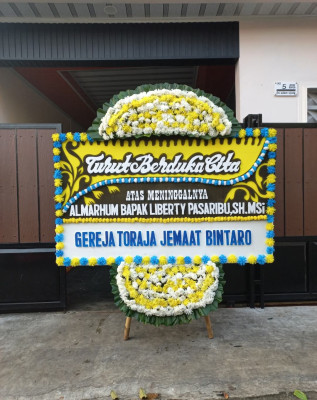 Papan Bunga Duka di Benu Benua