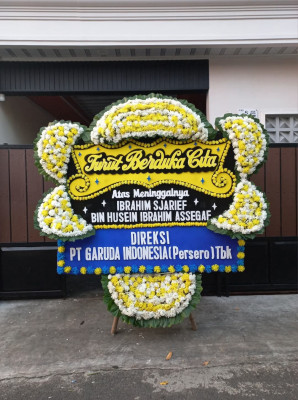 Papan Bunga Duka di Benu Benua